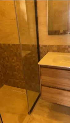 a bathroom with a shower and a sink at Luxe appartement in Bouznika