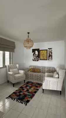a living room with a couch and two chairs at Dar Alyakoute - Harhoura in Temara