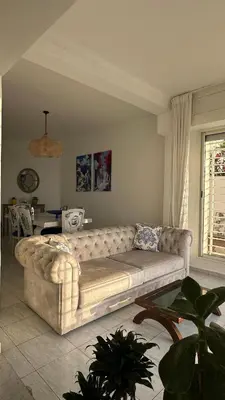 a living room with a couch and a table at Dar Alyakoute - Harhoura in Temara