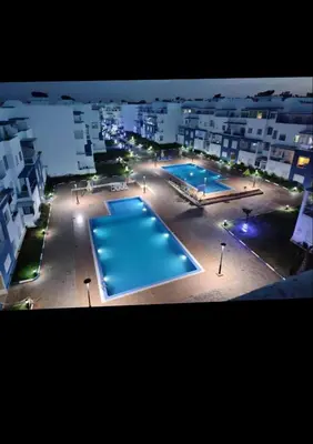 an overhead view of two swimming pools in a building at Appartement lux a mansoria les terrasses 2 et 3 in Mansouria