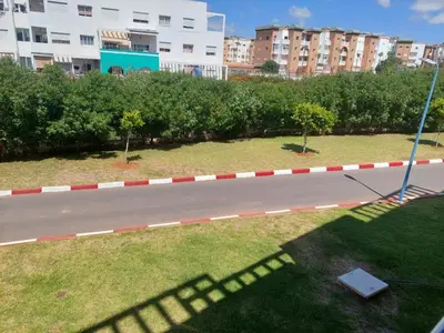 a road with red and white tape on the grass at Appartement lux a mansoria les terrasses 2 et 3 in Mansouria