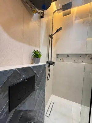 a shower in a bathroom with a glass wall at New apartment in the heart of Rabat in Rabat
