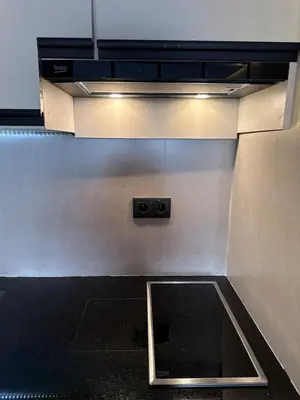 a kitchen with a sink in the middle at New apartment in the heart of Rabat in Rabat
