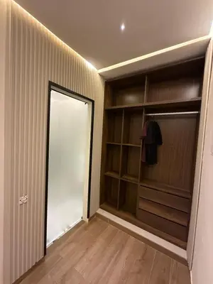 a walk in closet with a mirror and a door at New apartment in the heart of Rabat in Rabat