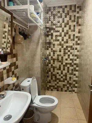 a bathroom with a toilet and a sink at Residence sables dor Mohammedia in Mohammedia