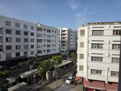 a view of a city street with white buildings at SUNSET Room in Rabat