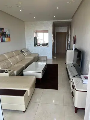 a living room with a couch and a table at La perle de Sidi by Rachid in Dar Oulad Hajj Kassem