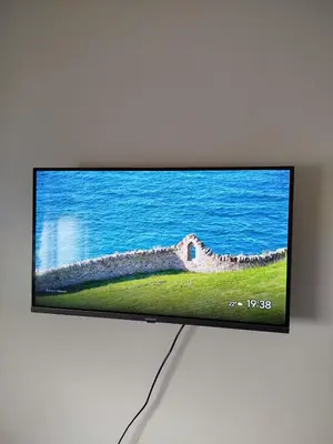 a flat screen tv sitting on top of a wall at Hatime zarkaoui in Casablanca