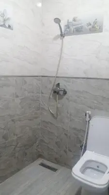 a bathroom with a shower and a toilet at Hatime zarkaoui in Casablanca