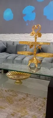 a gold coffee table in a living room with a couch at Modern and comfortable apartment in mohammedia in Ben Yakhlef