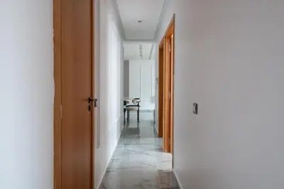 a hallway with a door and a table in a room at TT Holidays Centro in Rabat