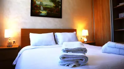 a bedroom with a bed with towels on it at Beautiful and cosy apartment in Casablanca