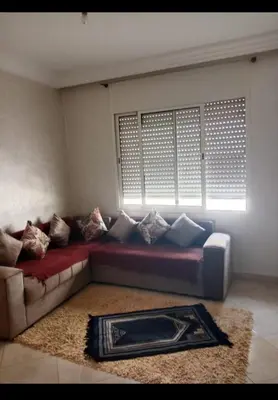 a living room with a couch and a window at Casablanca in Bouznika