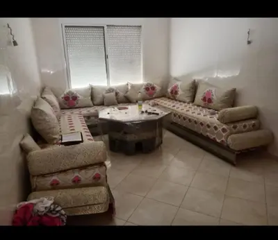 a living room with a couch and a table at Casablanca in Bouznika