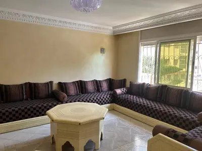 a large living room with couches and a table at Villa Chérine in Casablanca