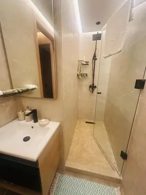 a bathroom with a sink and a shower at Hidden Central Cozy Gem Ghandi Calm Fast WiFi Parking in Casablanca
