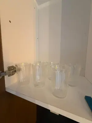 a row of empty glasses sitting on a shelf at Superbe Modern Studio Casa City Center in Casablanca