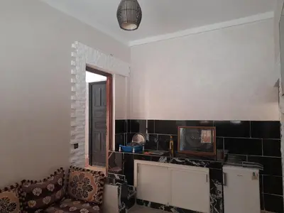 a living room with a couch and a window at Apartment Surf in Skhirat
