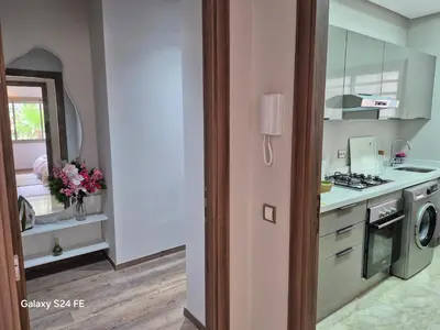 a kitchen with a sink and a stove top oven at Aeroperla Prestige Casablanca Airport in Nouaseur