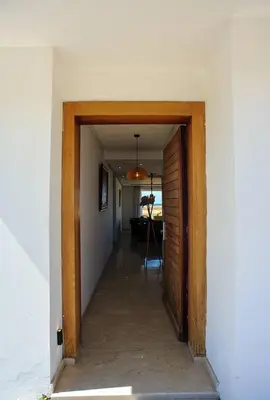 a hallway leading to a room with a door at Luxury Oceanfront 3BR Villa in Rabat, Plage Val d Or - Private Beach access & Spa in Temara