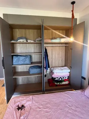 a bedroom with a bunk bed and a closet at Relaxing Apartment Oceanic Sidi Rahal in Sidi Rahal