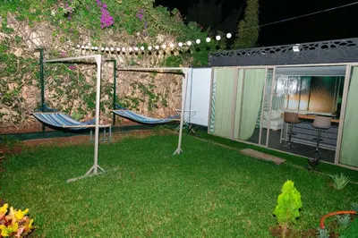 two chairs in a yard next to a house at Maison à Skhirat avec Jacuzzi et Jardin privé in Skhirat