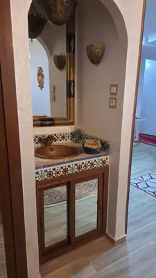 a bathroom with a sink and a mirror at Lux apartment Maarif in Maarif