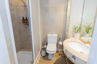 a bathroom with a toilet and a sink and a shower at Casa JOY in Casablanca