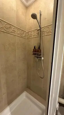 a bathroom with a shower with a tub and a sink at Casa JOY in Casablanca
