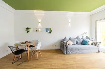 a living room with a bed and a table at Casa JOY in Casablanca