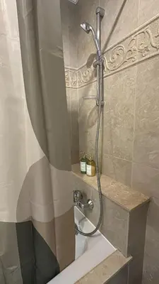 a shower in a bathroom with a shower curtain at Casa JOY in Casablanca