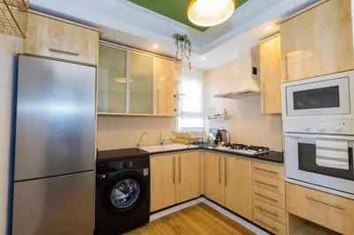 a kitchen with a stainless steel refrigerator and a dishwasher at Casa JOY in Casablanca