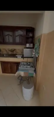 a kitchen with a stove in the corner of a room at Petit Nid Casablanca in Casablanca