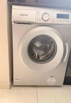 a washing machine is sitting in a room at Bright Cosy Apartment By Mohamed V Stadium in Casablanca