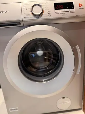 a close up of a washing machine with its door open at Cosy Modern Retreat in Casablanca in Casablanca