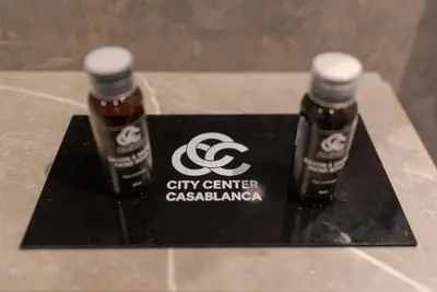 two bottles of city center cacienda sitting on a black plaque at Casablanca City Center Maarif in Casablanca