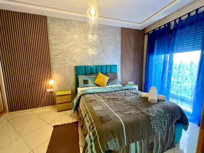 a bedroom with a large bed and a window at Luxury Casablanca Studio - Close to Tram in Casablanca
