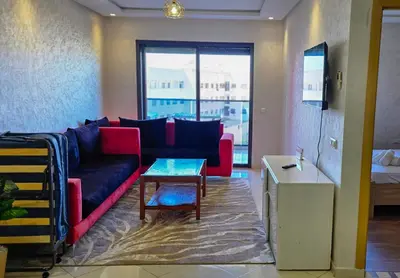 a living room with a couch and a table at Luxury Casablanca Studio - Close to Tram in Casablanca