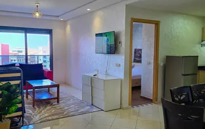 a kitchen and living room with a couch and a refrigerator at Luxury Casablanca Studio - Close to Tram in Casablanca