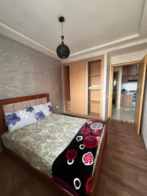 a bedroom with a bed with roses on it at Casablanca luxury Studio in Casablanca