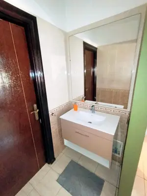 a bathroom with a sink and a mirror at heartofrabat in Rabat