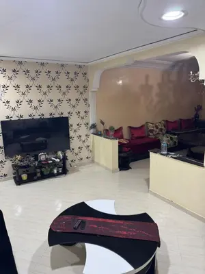 a living room with a couch and a fireplace at Maison kossay in Casablanca