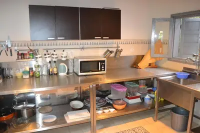 a kitchen with a counter with a microwave on it at beachfront house frond de mer in Skhirat