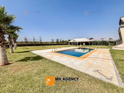 a swimming pool in a yard with a gazebo at Oliveraie - Villa Benslimane in O Ben Slimane