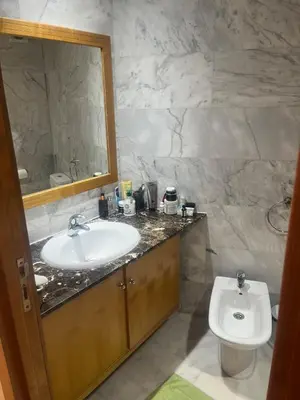 a bathroom with a sink and a toilet at Evazion in O Ben Slimane