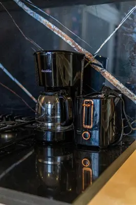 a coffee cup sitting on top of a counter at maarif Centre elegant et comfortable duplex in Casablanca