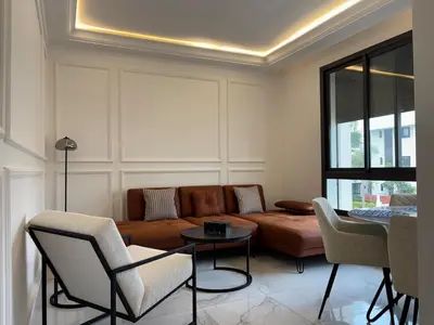a living room with a couch and chairs at Sun of Biarritz, Breeze of Casablanca in Casablanca