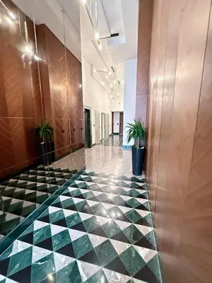 a lobby with a green and white checkered floor at Luxurious Boho-Styled Duplex - Rooftop Sky Pool in Casablanca