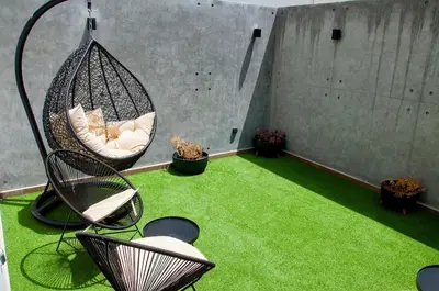 a room with a hammock and green grass at Luxurious Boho-Styled Duplex - Rooftop Sky Pool in Casablanca