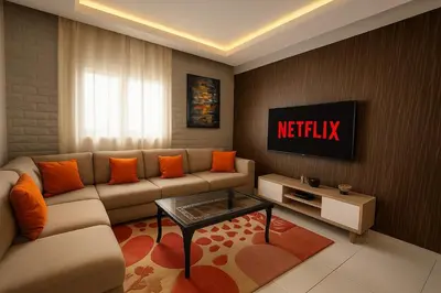 a living room with a couch and a tv at Modern Cozy Apartment Near beach in Casablanca